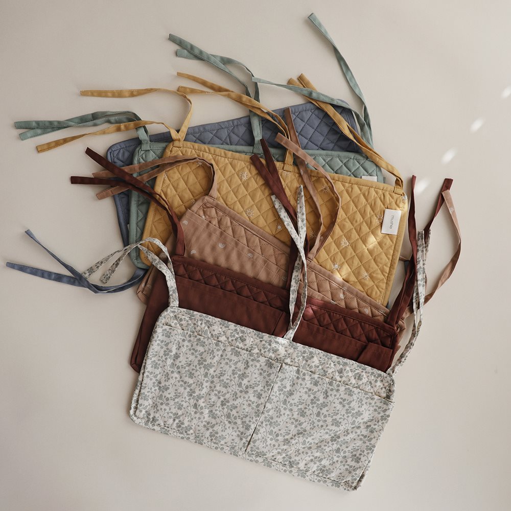 mushie Babybett Tasche Crib Pocket Organizer Sun